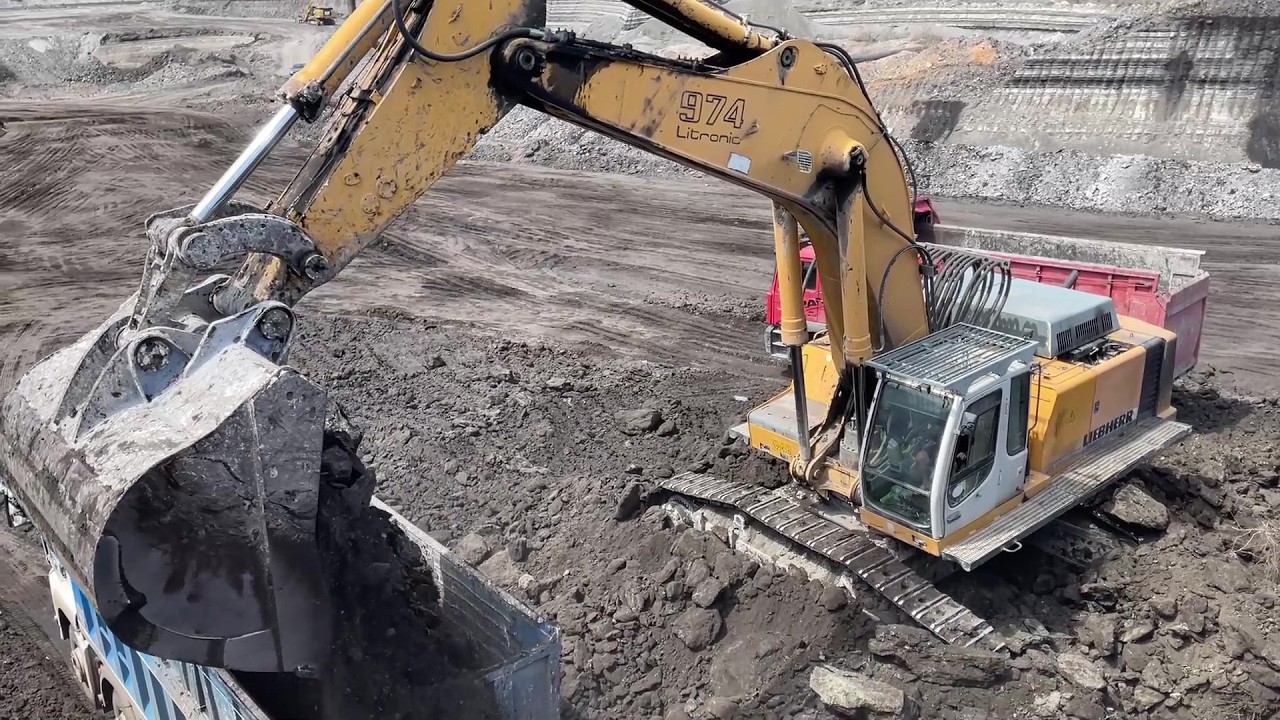 Liebherr 974 Excavator Loading Overburden &Alpha;t &Alpha; Busy Mining Site - Ascon Ltd