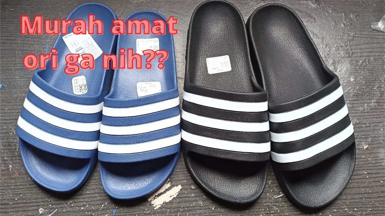 sendal adidas qo murah banget, coba kita bandingin dah.