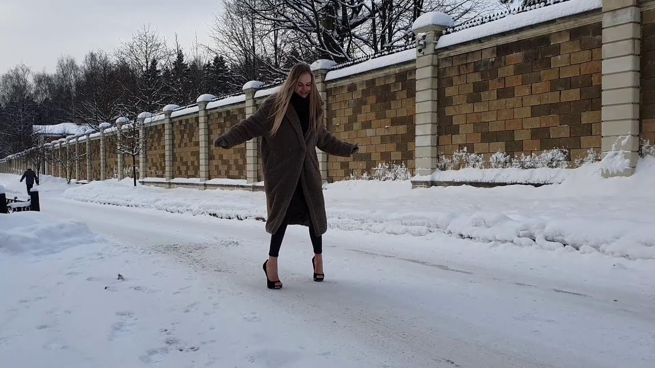 Sexy Julia walking in heelless Zanotti shoes on very slippery icy road, shoes on ice (scene 669)