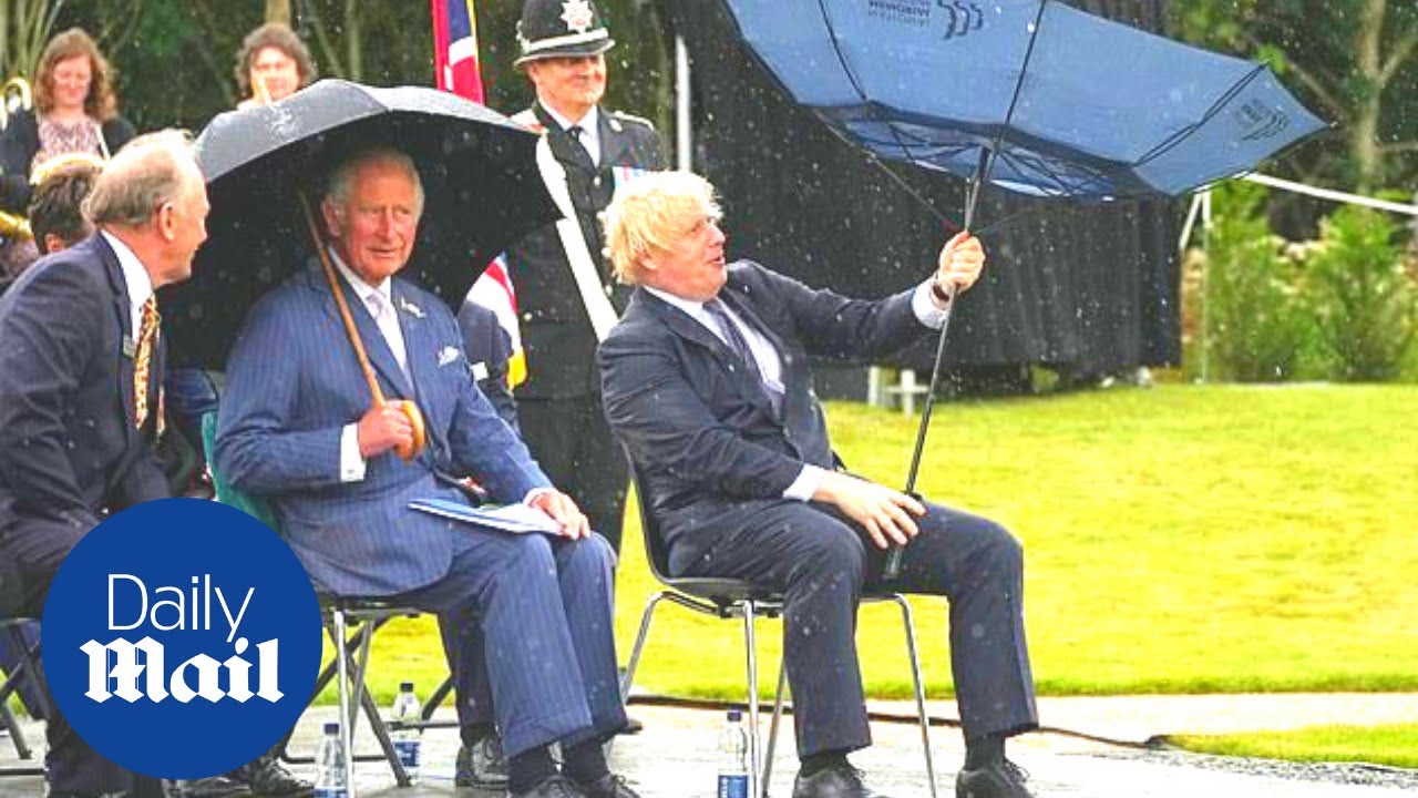 Boris Johnson has hilarious awkward struggle with umbrella at police memorial dedication