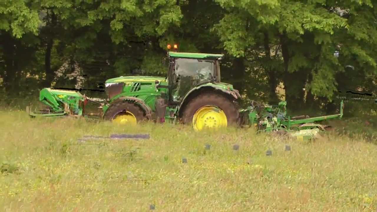 John Deere 6210R with Triple Mowers.