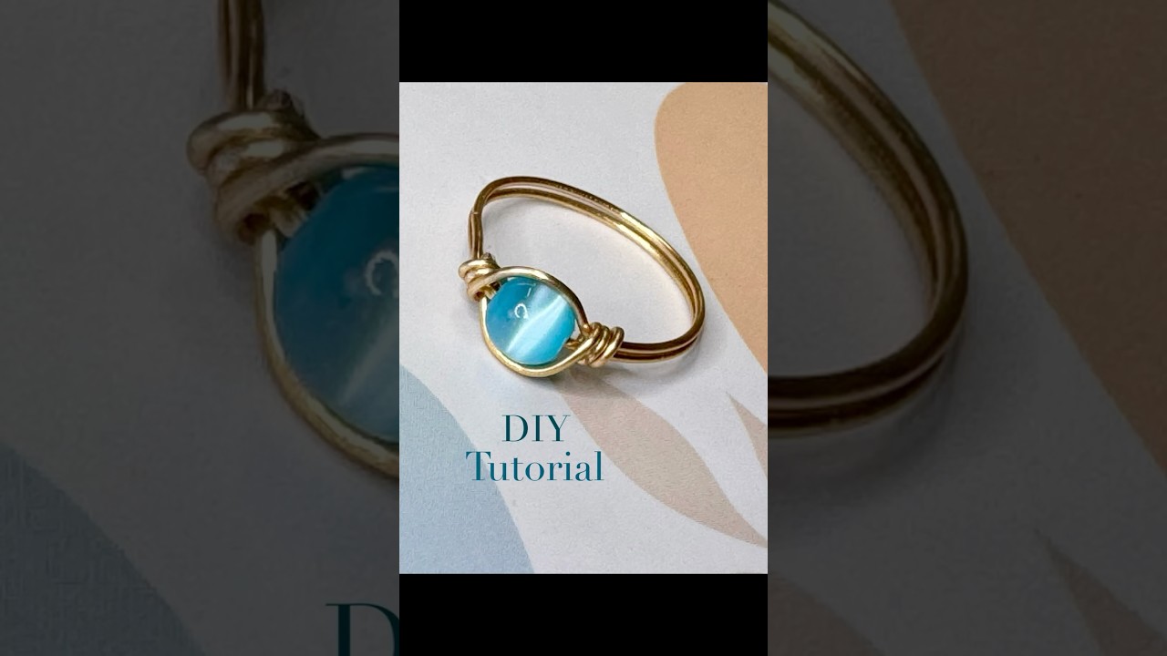 A delicate ring made of gold wire and a shimmering mother-of-pearl bead &ndash; handmade with love!