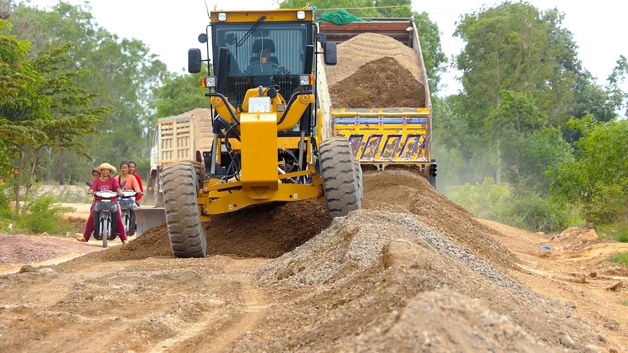 VILLAGE Road Construction Site with many Land Trucks, SANY Motor Grader. Awesome Gravel Pushing
