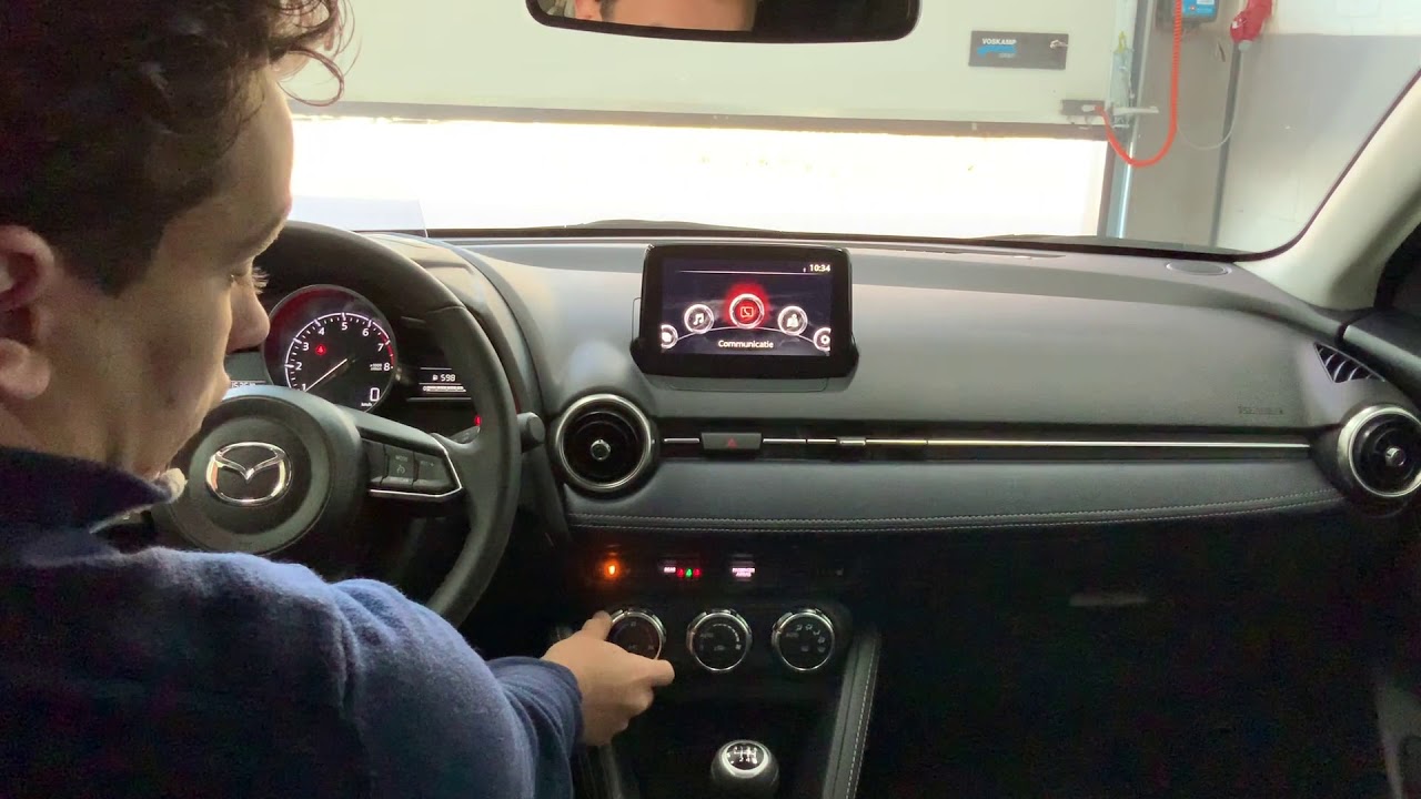 Uitleg bediening verwarming/airco en stoelverwarming Mazda 2