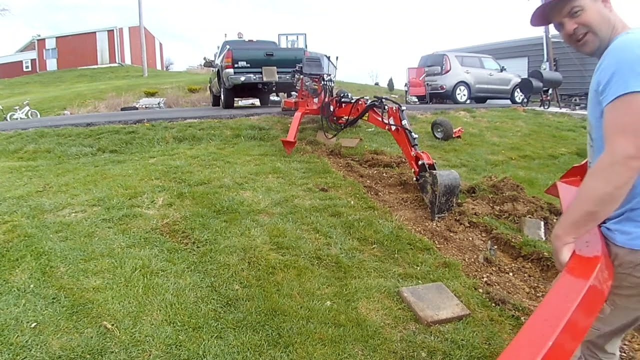 Beginner with towable backhoe digging for a sidewalk: attached and detached. Clearly NOT a tutorial!