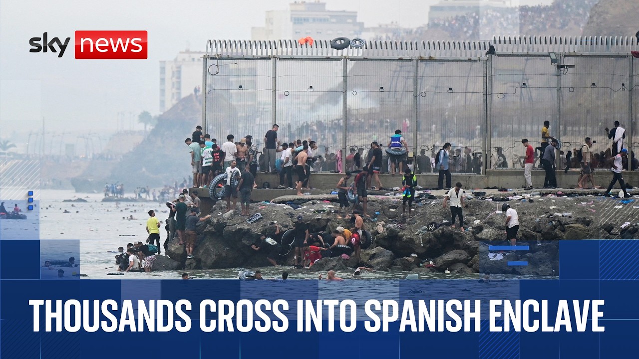 Thousands of migrants enter Spanish enclave from Morocco