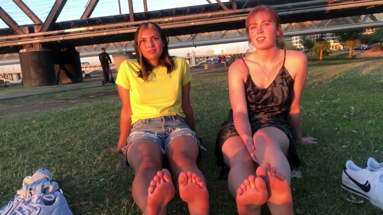 Two girls show their sweaty and stinky feet in public