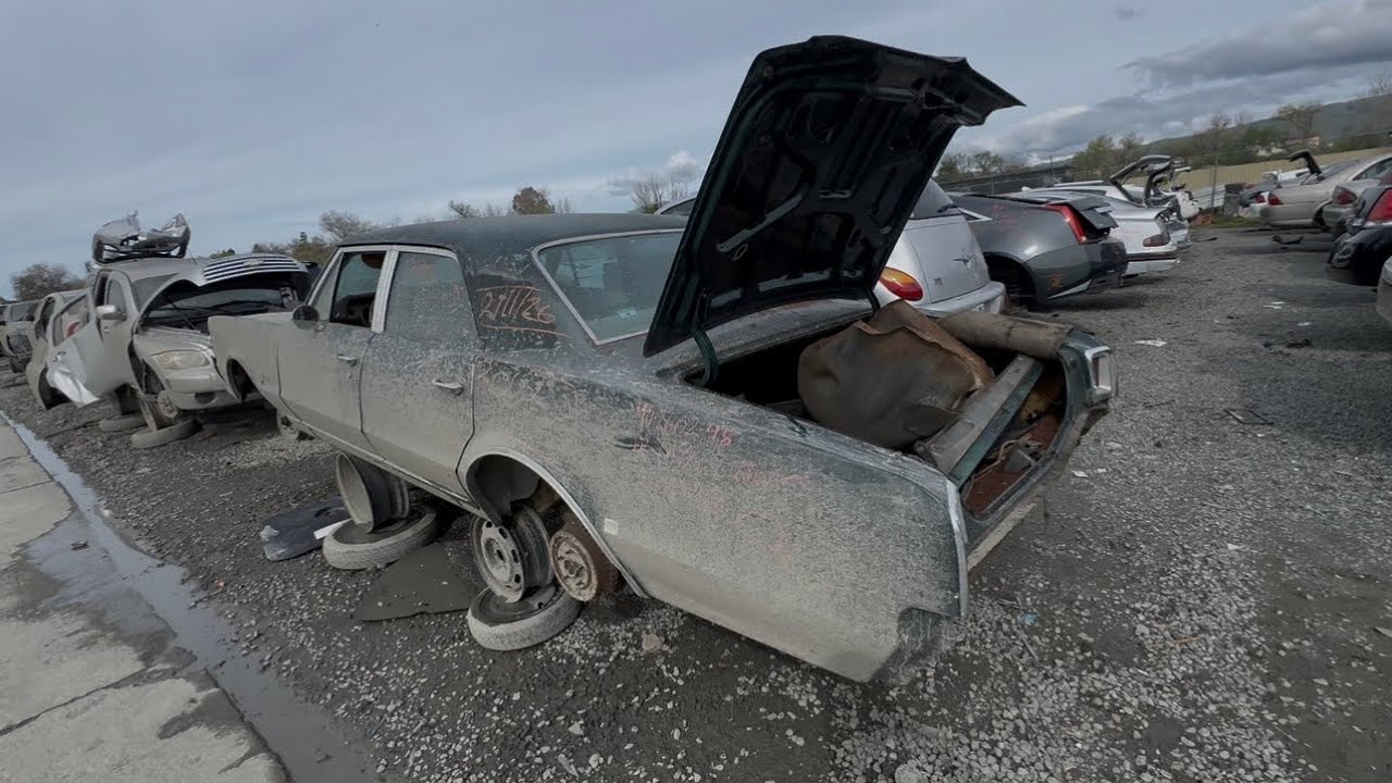 1963 Oldsmobile Super 88 & a 1967 Oldsmobile Cutlass at Junkyard in San Jose California 