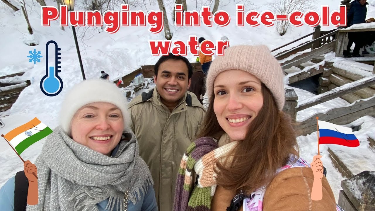 2 RUSSIANS AND AN INDIAN jumping into ice-cold water on Epiphany Day.
