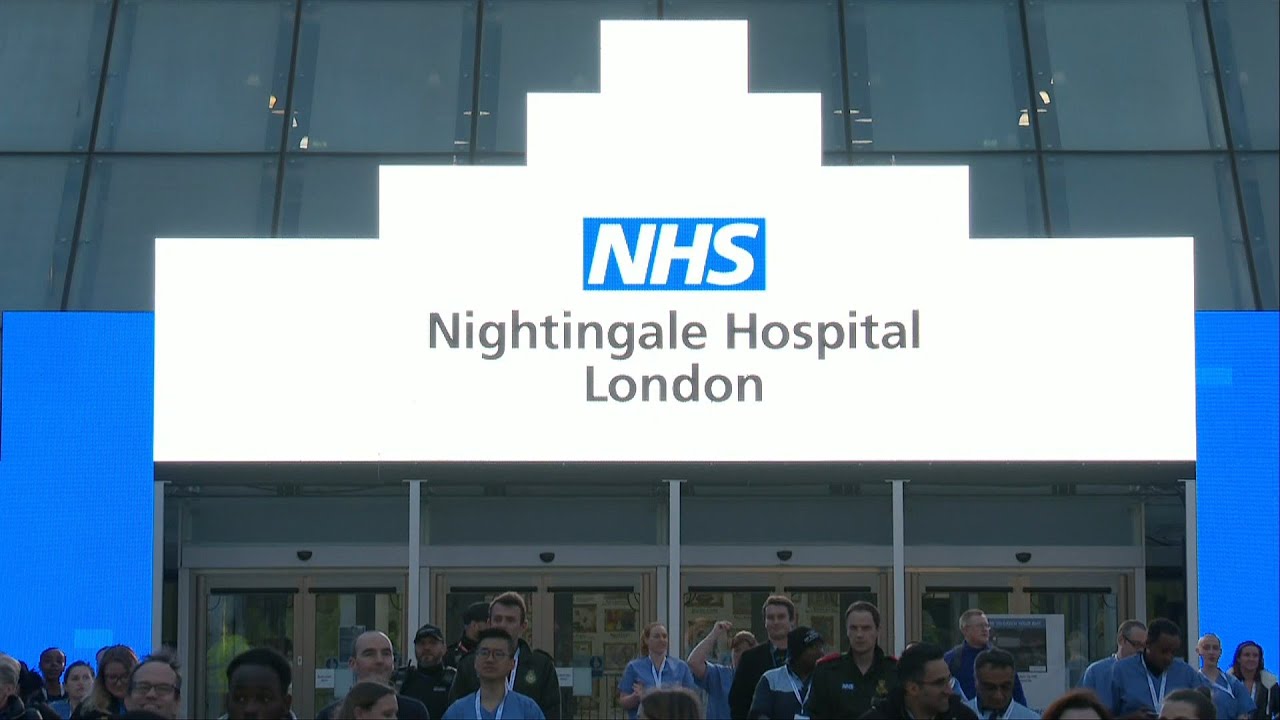 Medical workers at NHS Nightingale field hospital take part in weekly 'Clap for Carers' | AFP