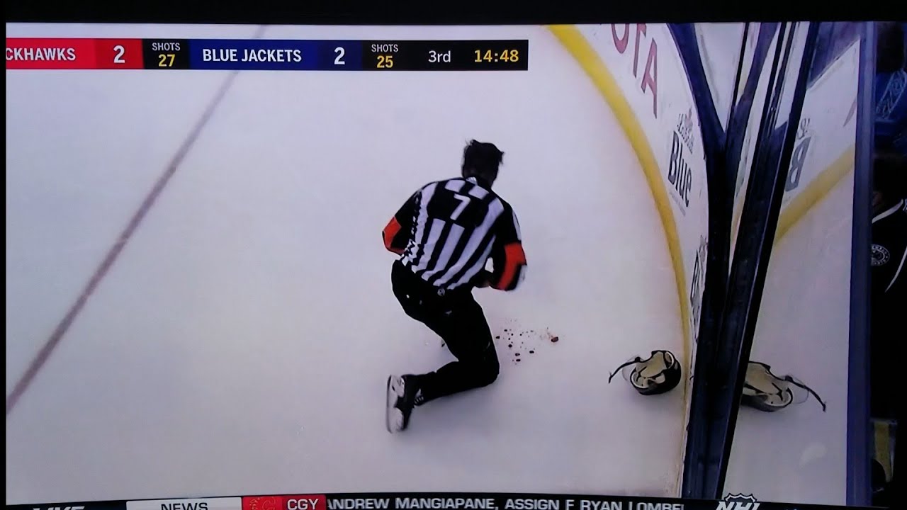 NHL Referee Garrett Rank left bloody after high stick to the mouth