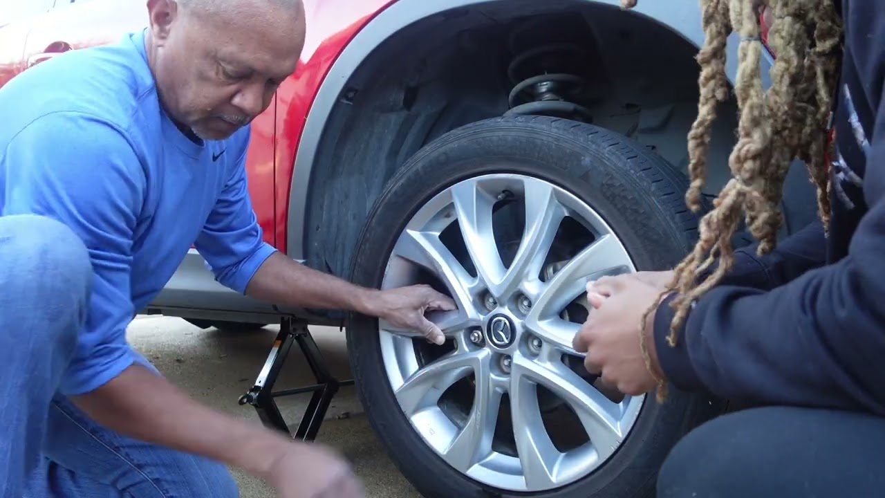 How To Change A Tire In 9 Minutes! With My Dad