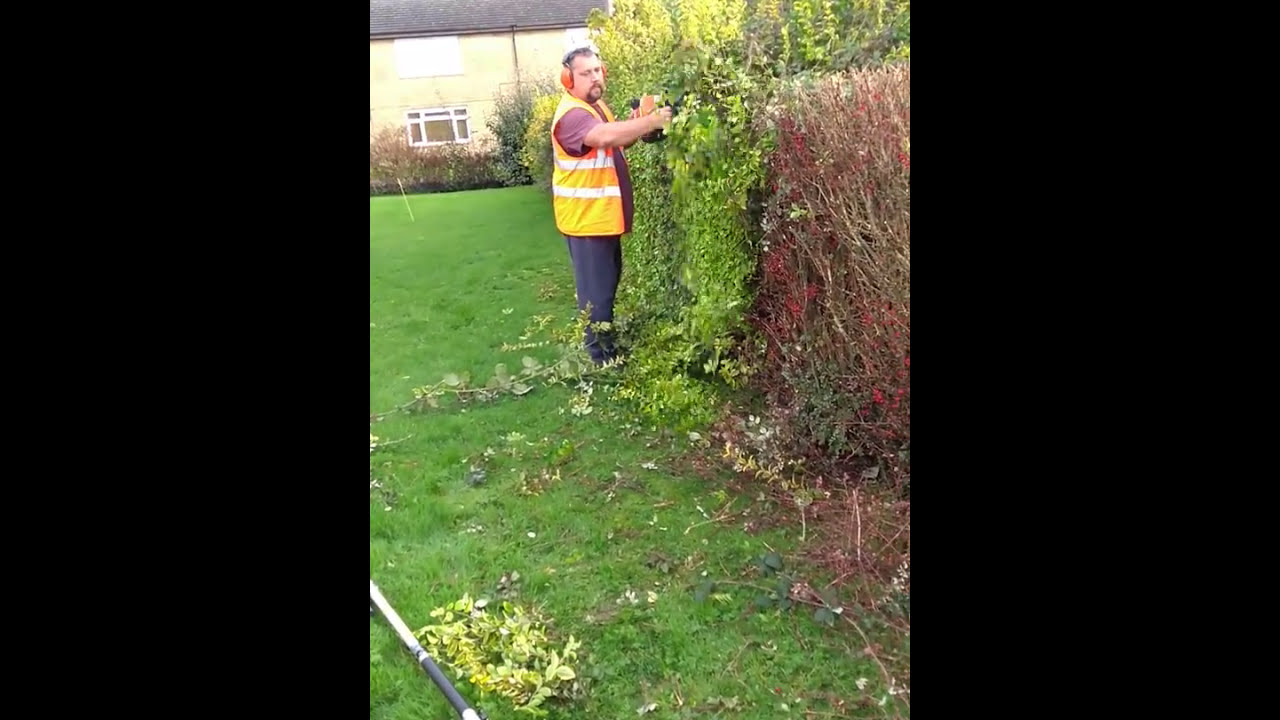 Stihl HS86rt hedge cutter in action