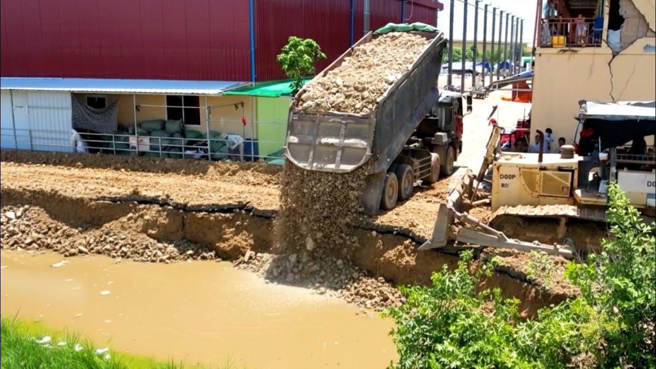 Incredible !! heavy dump truck 25.5T unloading soil landfilling with big bulldozer working push soil