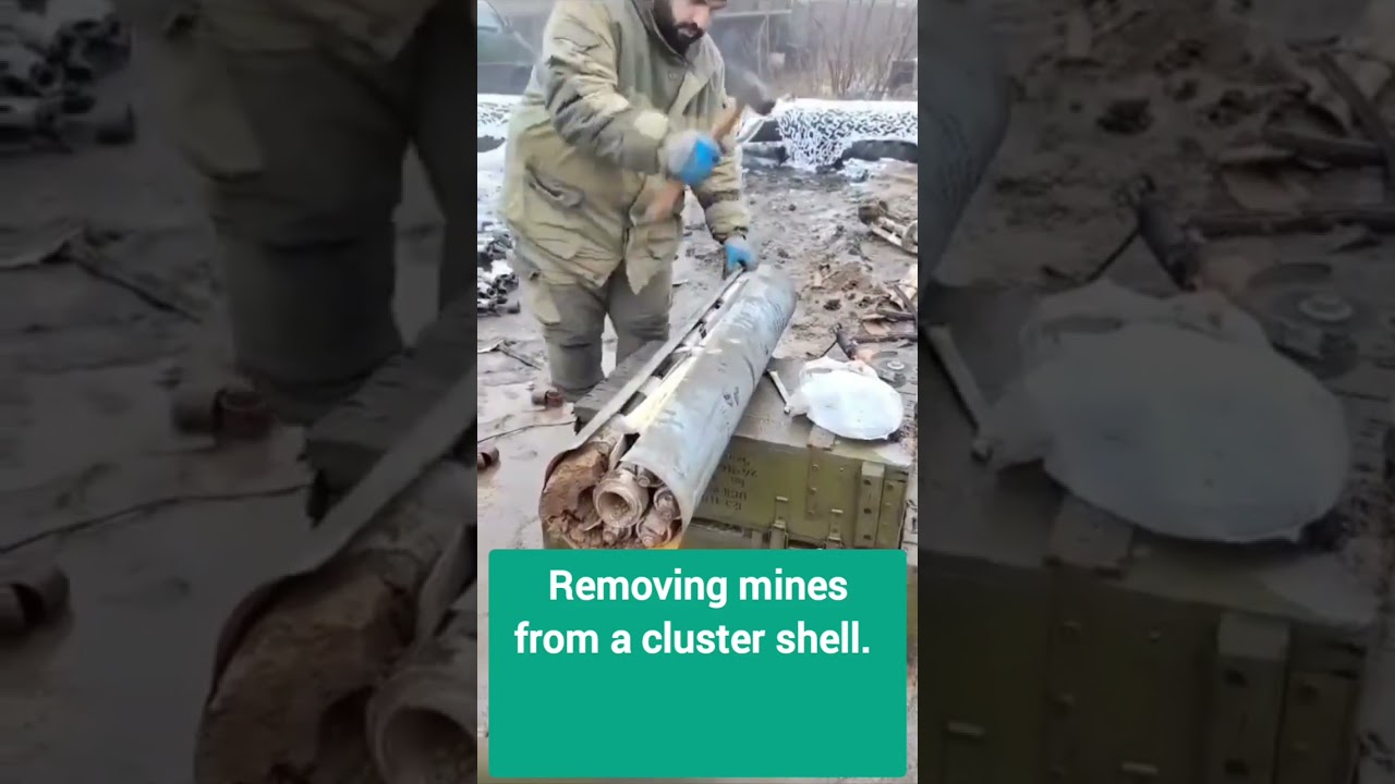 Dangerous work of a sapper with a cluster shell