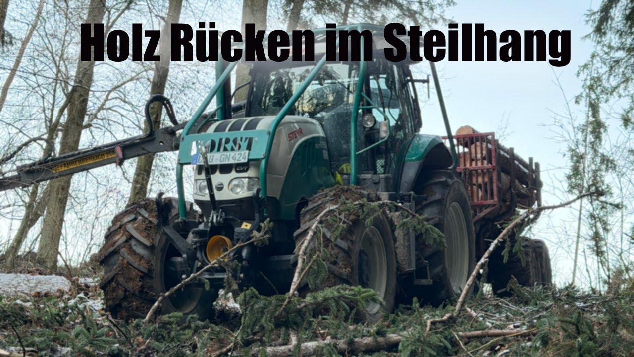 Holzrücken mit Steyr Forstschlepper und 16 t Rückewagen im Steilhang