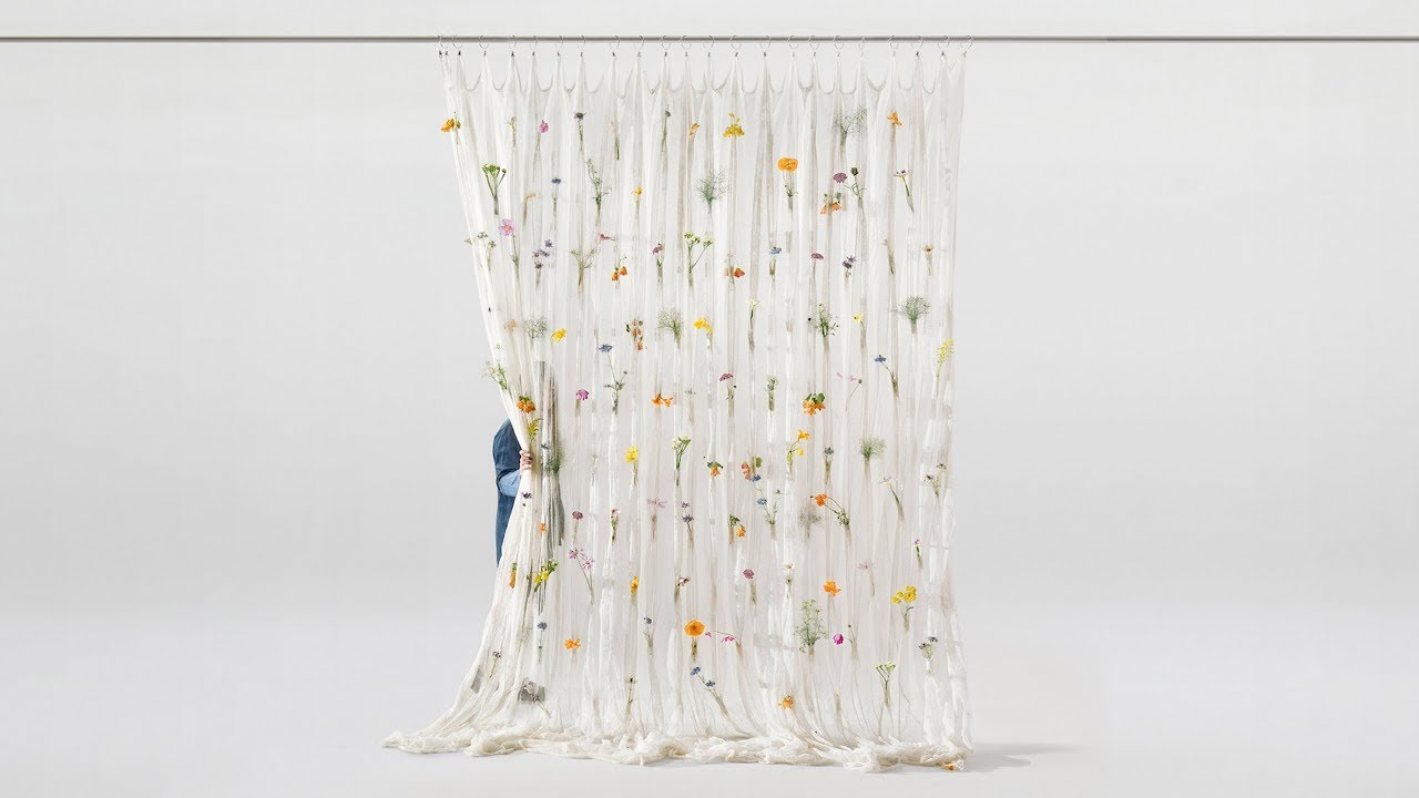 Fresh blooms decorate Draped Flowers Curtain woven from paper