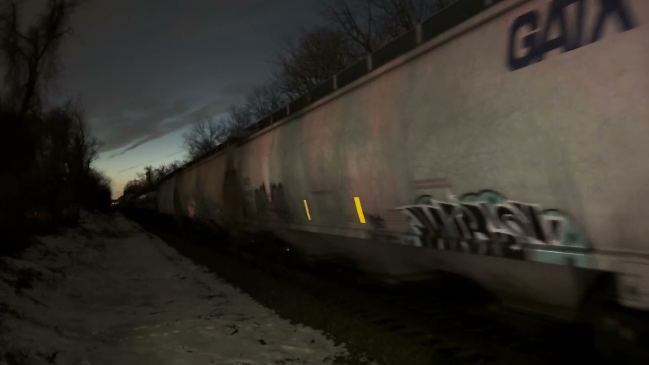 NS 8060 ES44AC leads NS K76 at south Plainfield  