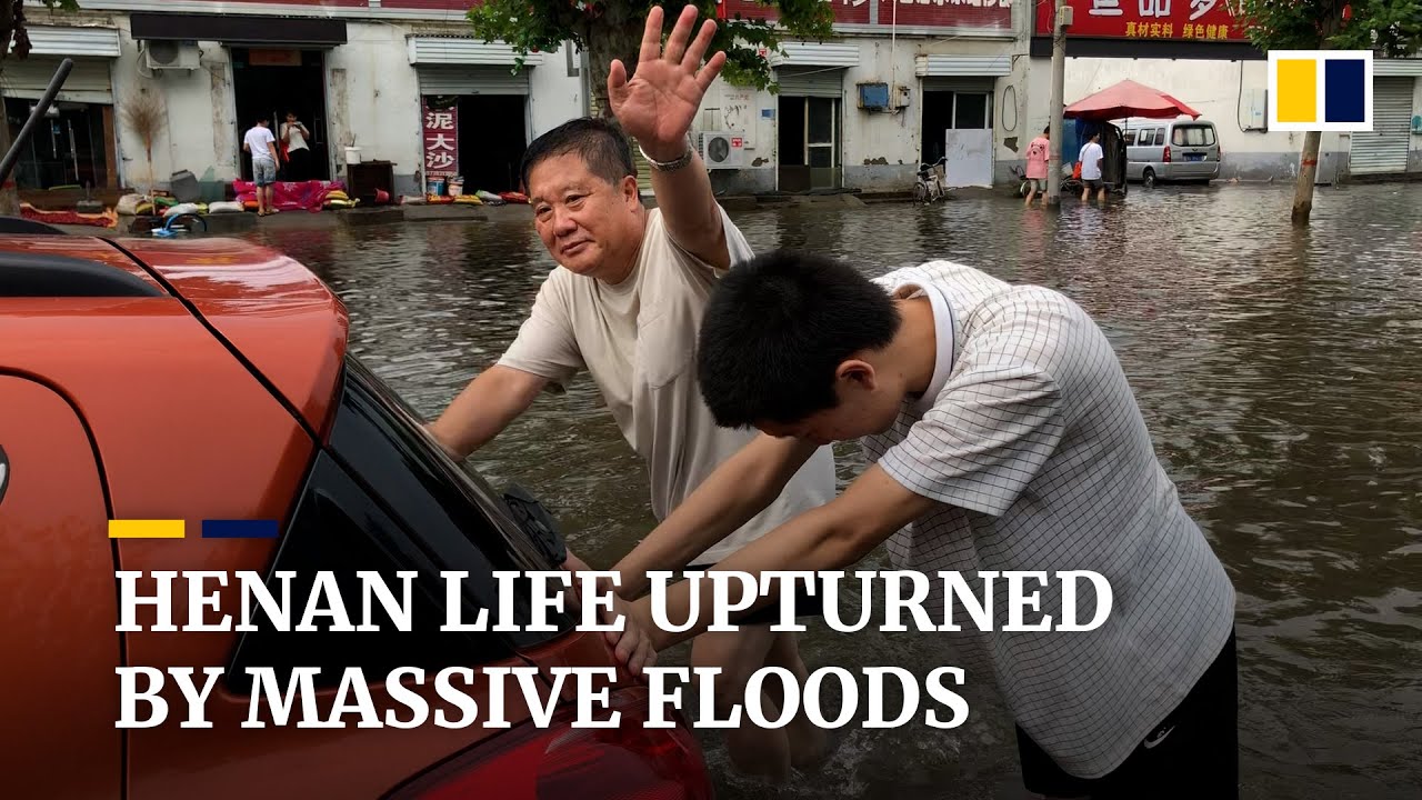 Residents of Xinxiang in China's Henan province cope with continued threat of floodwaters