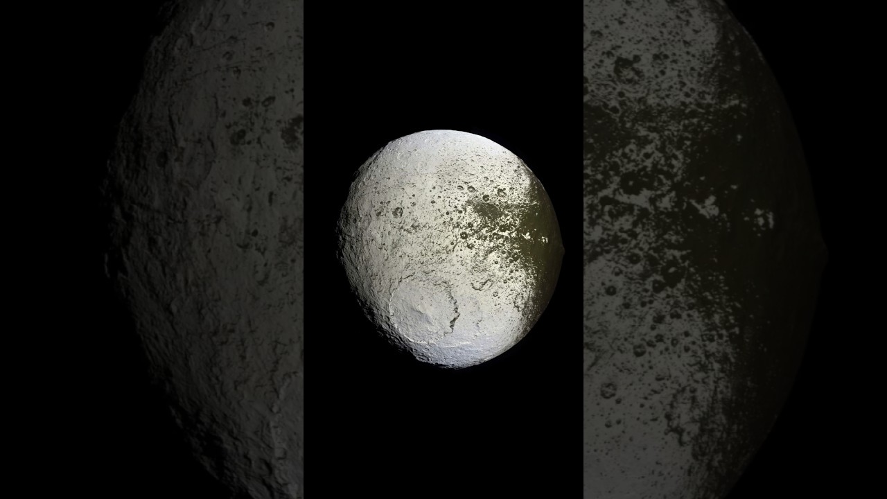The Mystery of Saturn's Two-Tone Moon