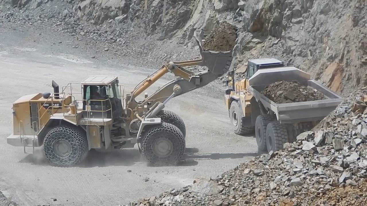 Caterpillar 988H and Dump Truck Caterpillar and Komatsu in action in the quarry