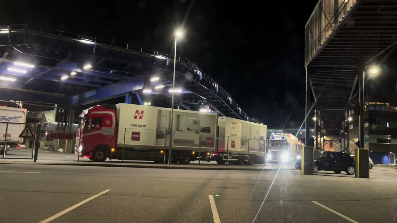 Scania, Volvo trucks driving off and on Color Line ferry from Norway.