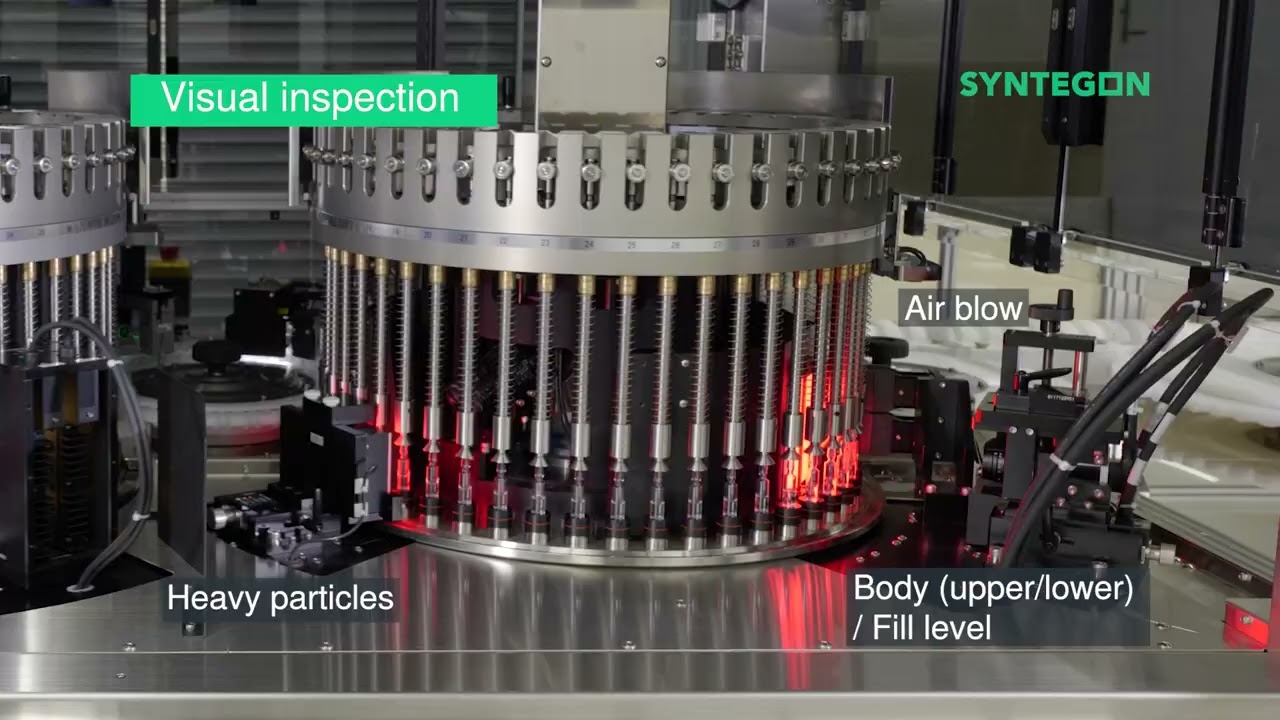 Automated inspection machine for ampoules