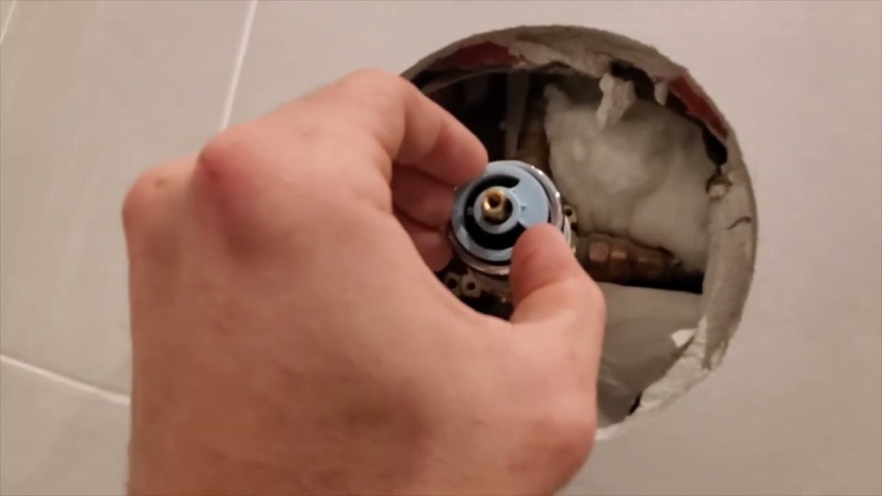 How to adjust temperature setting on Delta shower valve
