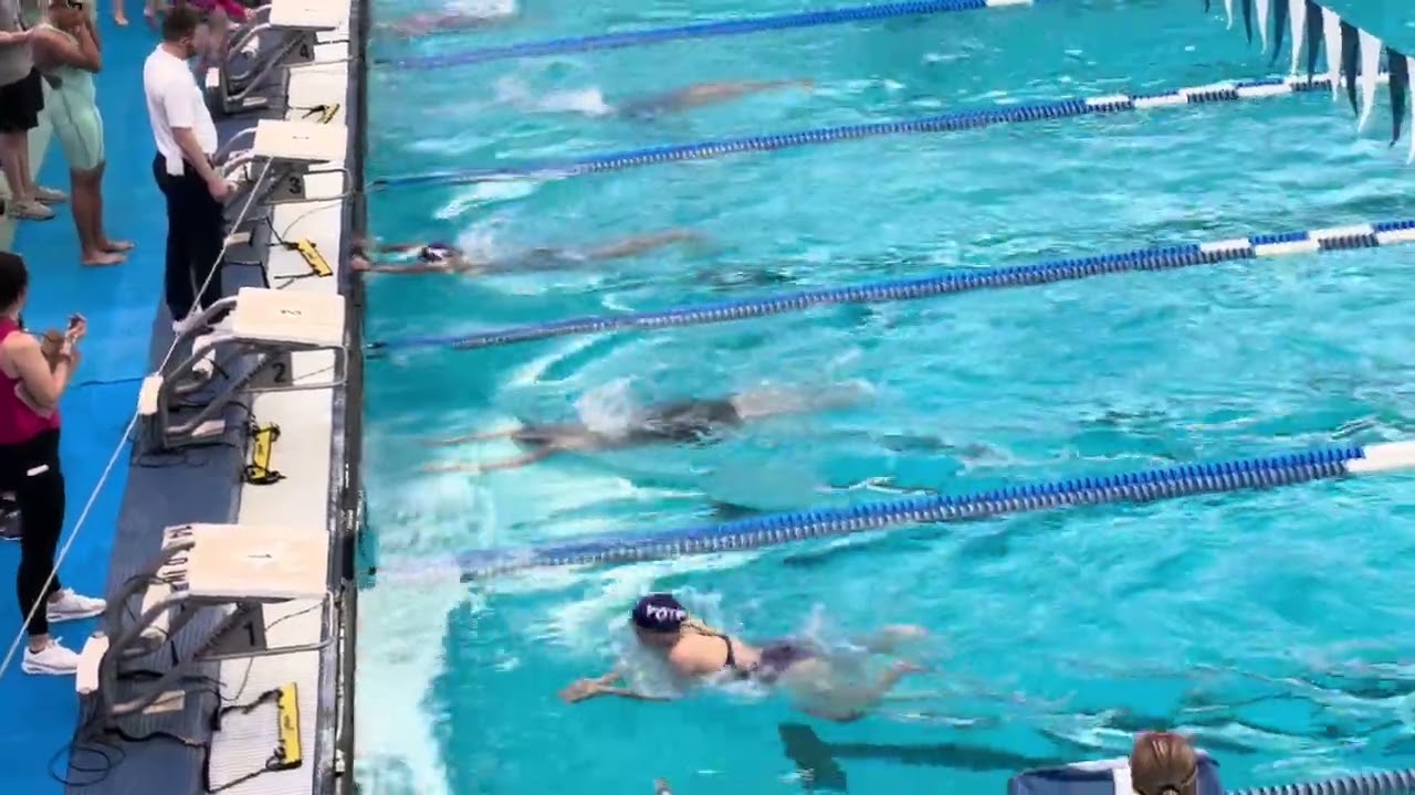 Scarlett Conard (16) in lane 2 drops 2 seconds in 100 Breaststroke 