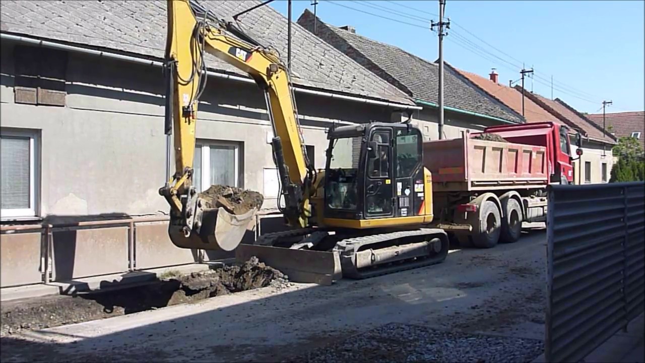CATERPILLAR 308E loading TATRA Phoenix