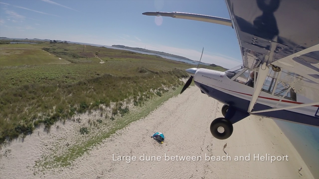 Aviat Husky landing at the heliport on Tresco, Scilly Isles (Southern Approach)