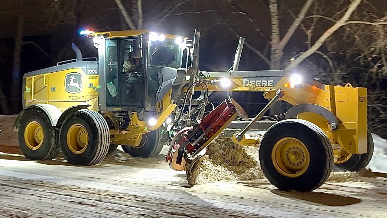 Snow Removal Operation With Graders Plowing Snow and Massive Snow Blower