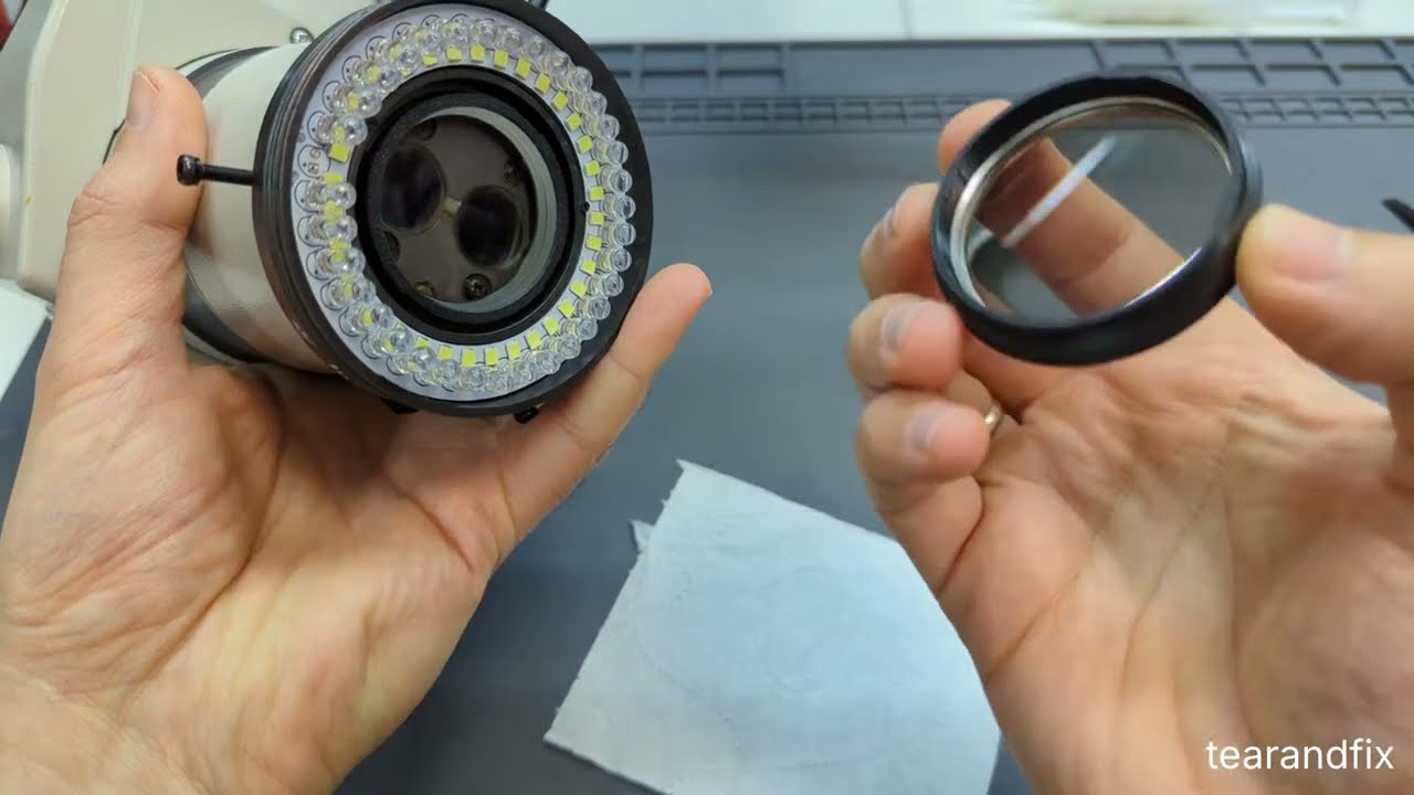 Modified microscope polarized light attachment with 0.7x Barlow lens.