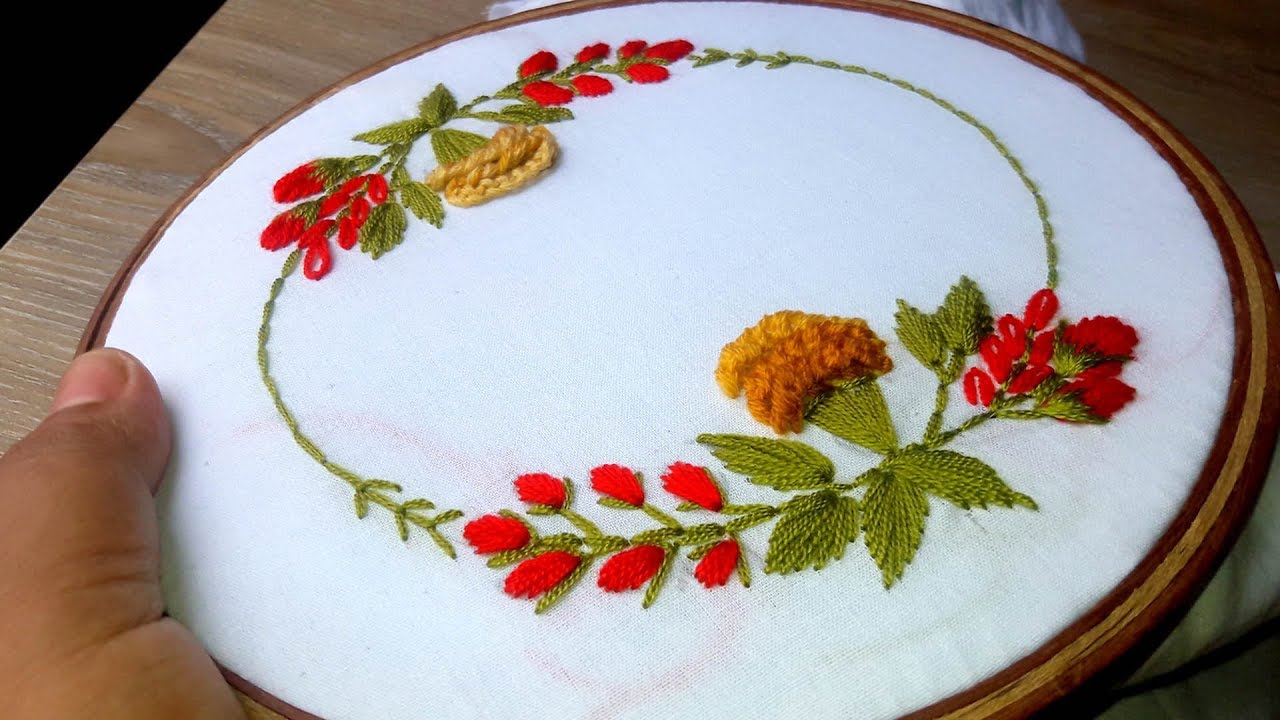 Hand embroidery : Embroidery for cushion covers design .