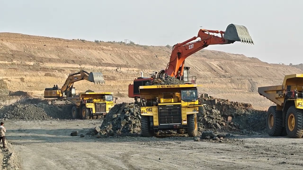 Tata Hitachi 1200V and Sany SY980HS excavators loading Komatsu HD785