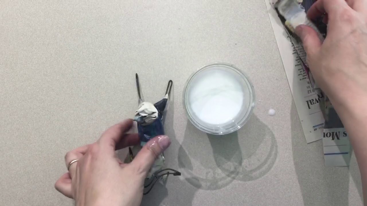 How to add papier-mâché strips to a wire armature