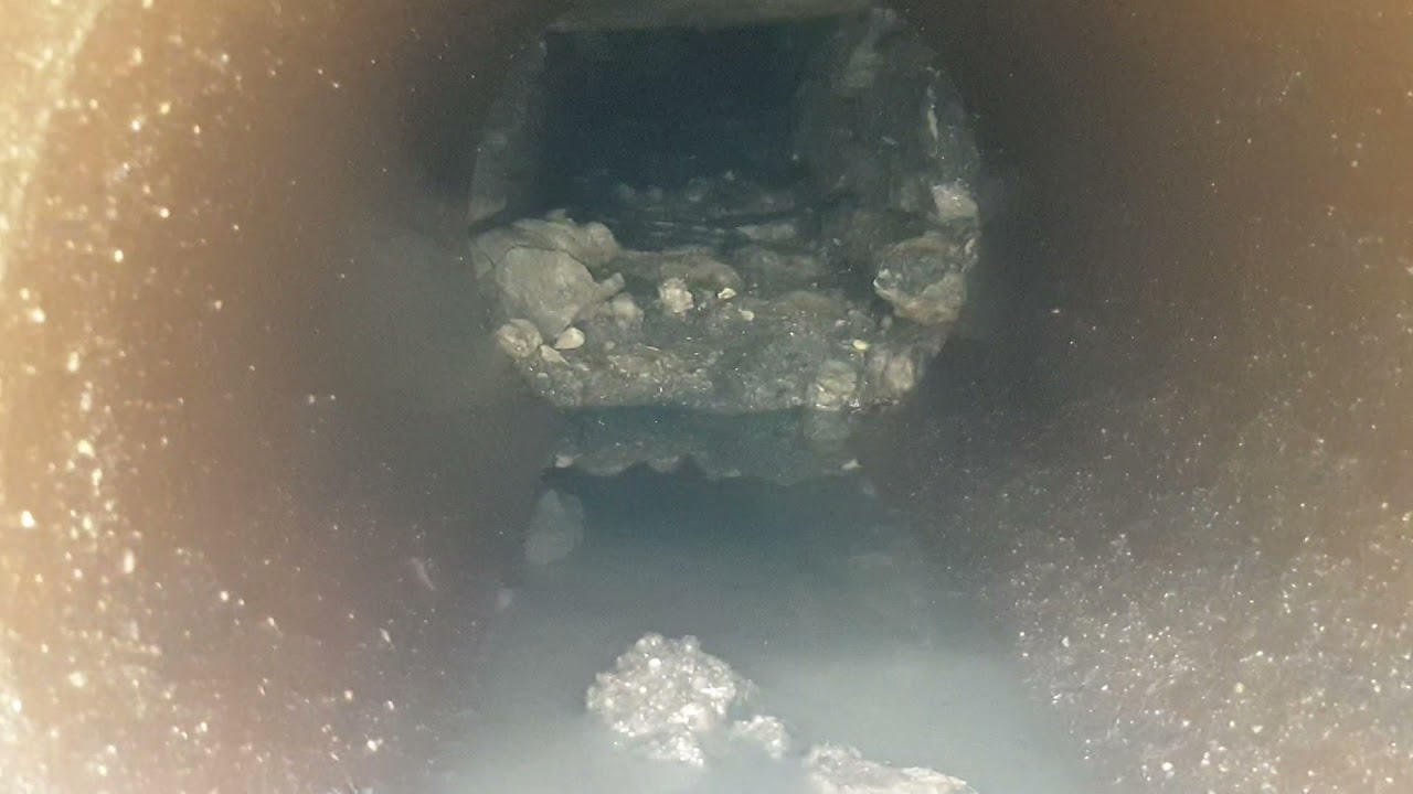 Jetting heavily silted stone box culvert.