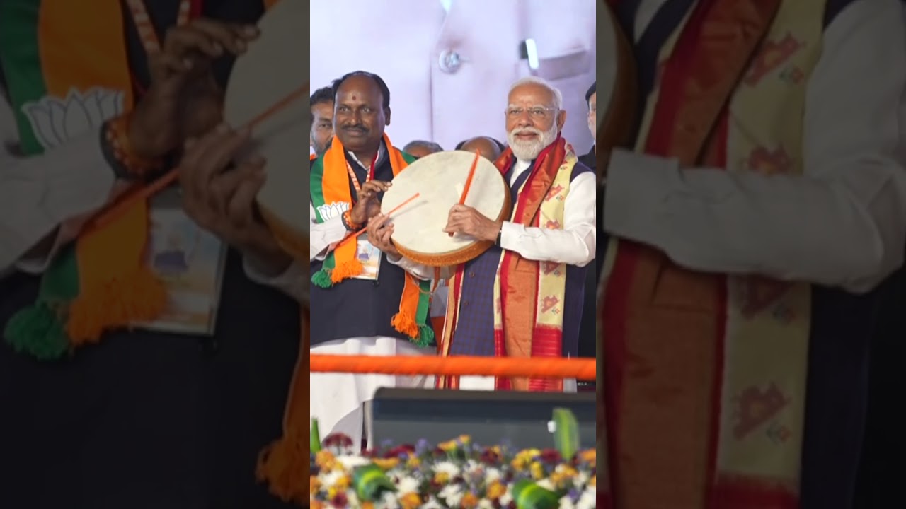 PM Modi plays an instrument at Hyderabad rally