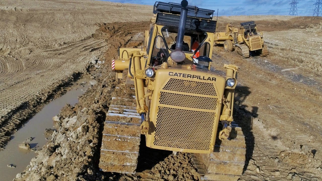 Digging out a Reservoir with Scrapers