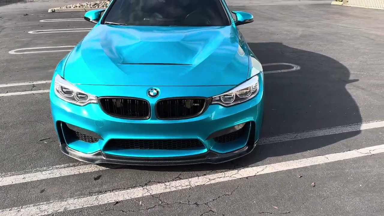 BMW M4 competition wrapped in Atomic teal
