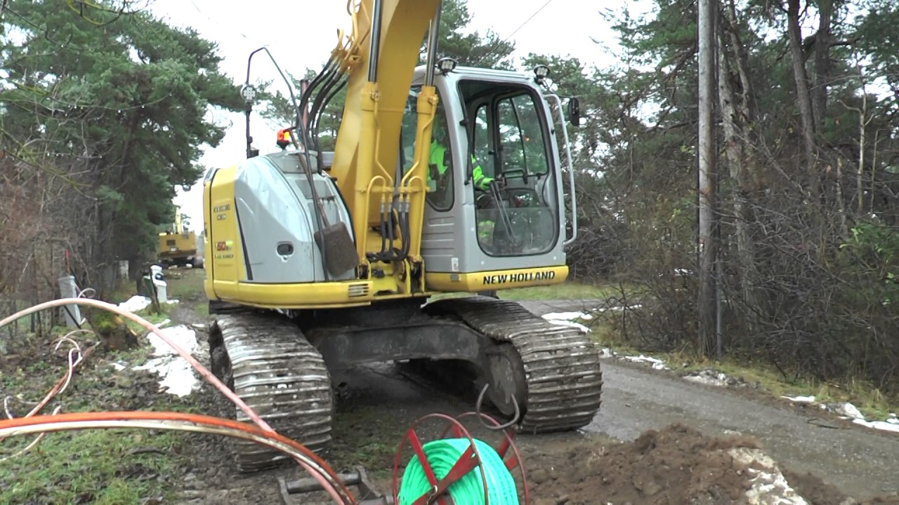 New Holland Kobelco E 150 excavator used in fiber cable trenching outside Visby November 2016