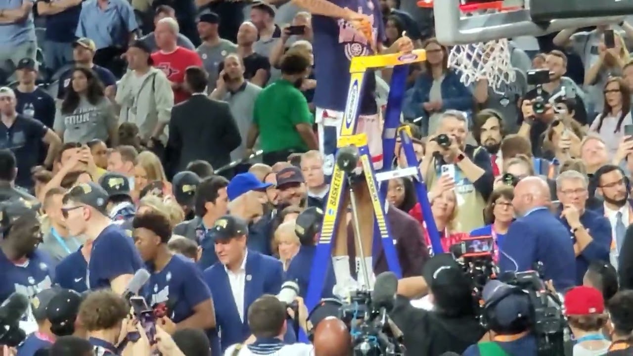 2023 NCAA Championship - Jordan Hawkins cutting down the nets.