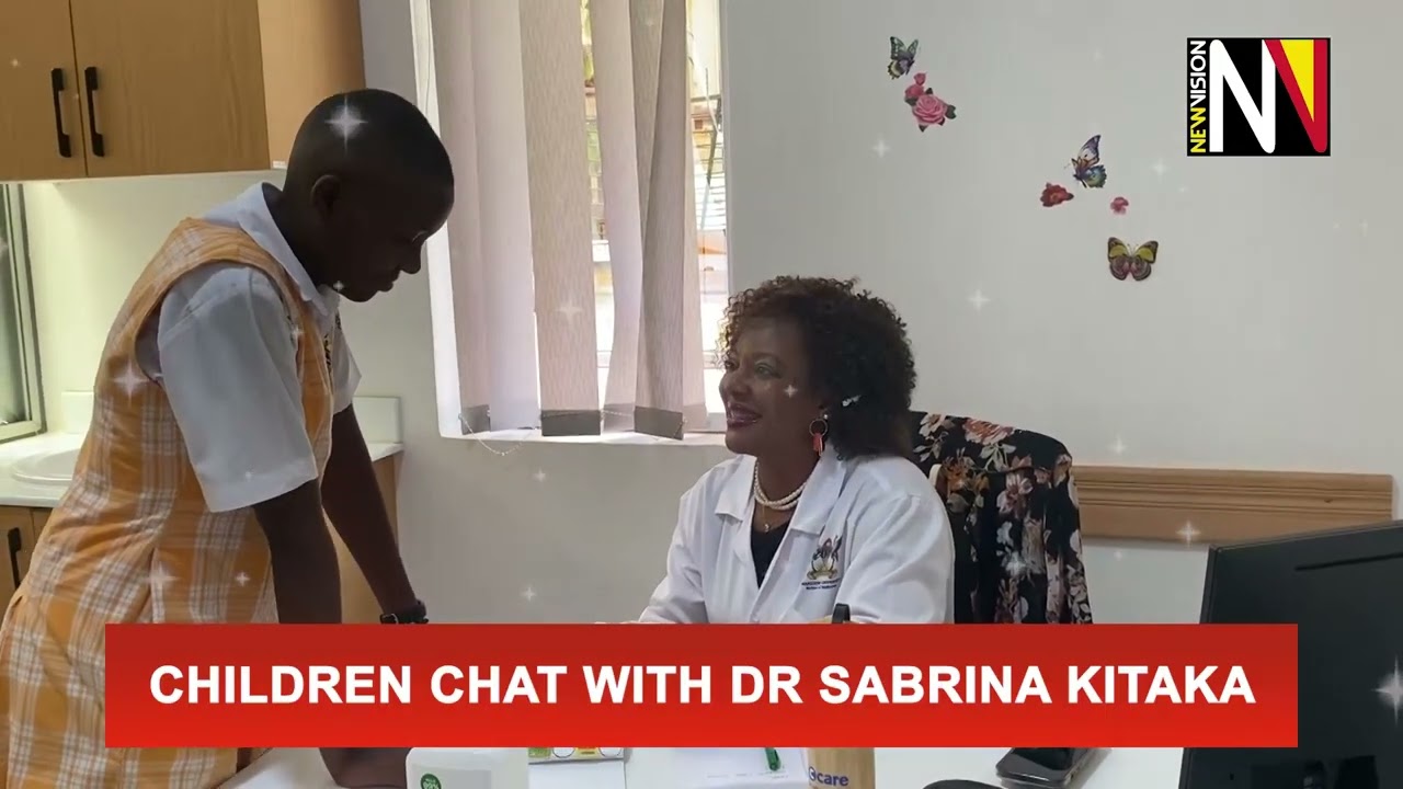 Children chat with Dr Sabrina Kitaka