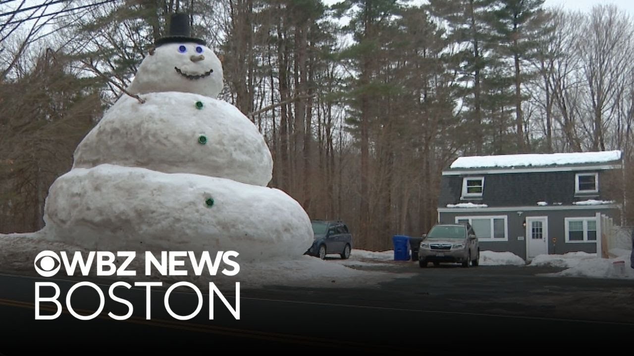 Family builds massive snowman at Massachusetts home