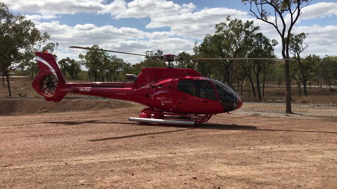 Airbus EC130T2 Helicopter lifting off from Australia Outback