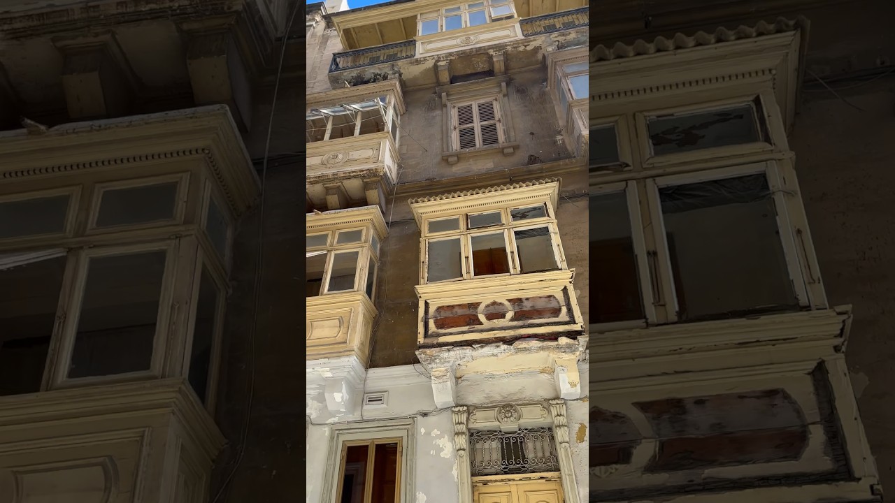 Traditional Maltese balconies and church bell in Valletta