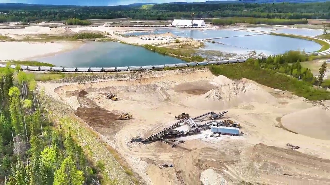 Drone view gravel pit frac sand and Athabasca river