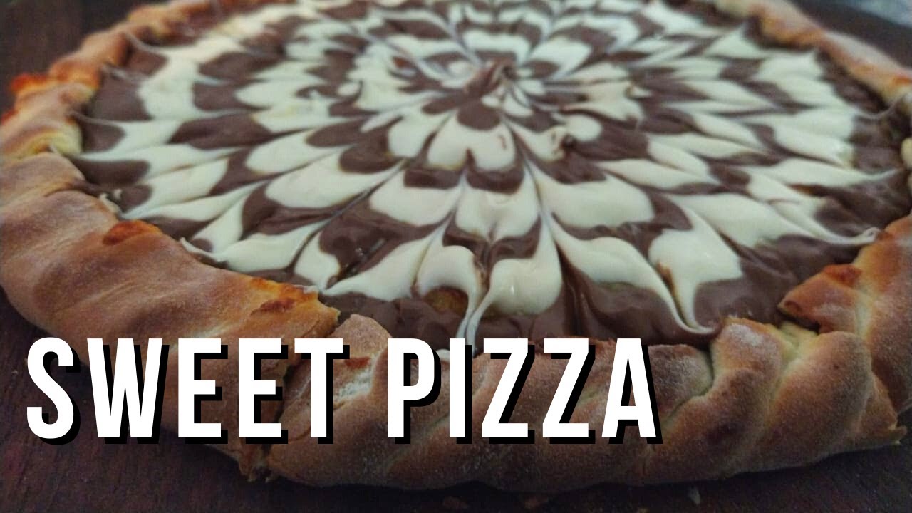 Making a delicious milk chocolate sweet pizza