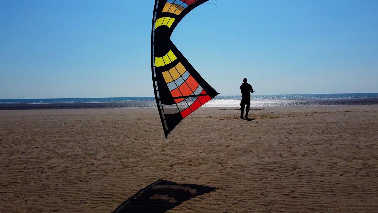 Back to the beach, flying a quadline sports kite on a beach in the north west of the UK.