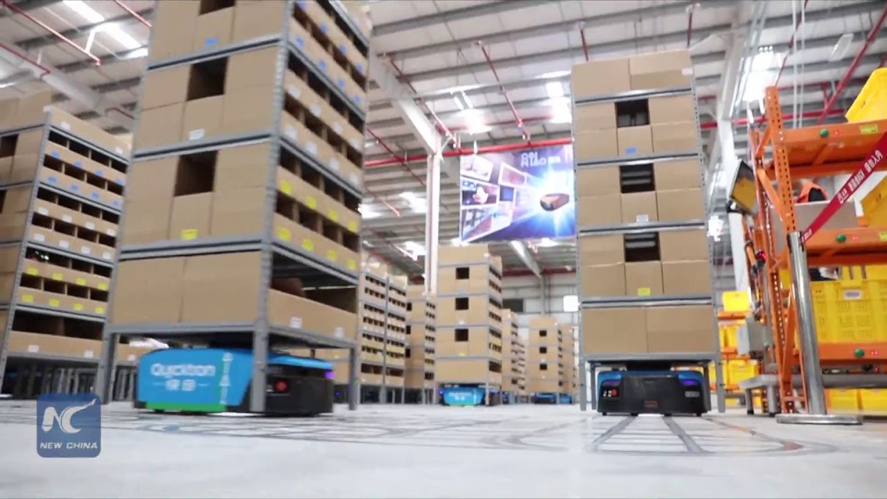 Robots deliver goods in China's largest smart warehouse
